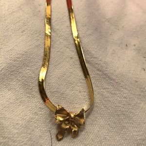 Brand new never worn 14kt yellow gold bow earrings